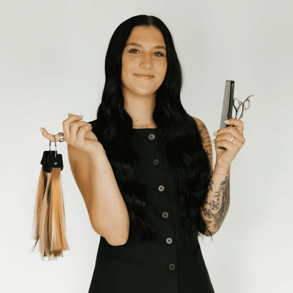 Portrait of Lily Bauer, a professional stylist at Ashlyn Jamyson Salon & Spa, showcasing their expertise and style.