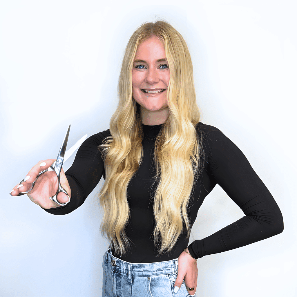 Portrait of Bella Burton, a professional stylist at Ashlyn Jamyson Salon & Spa, showcasing their expertise and style.