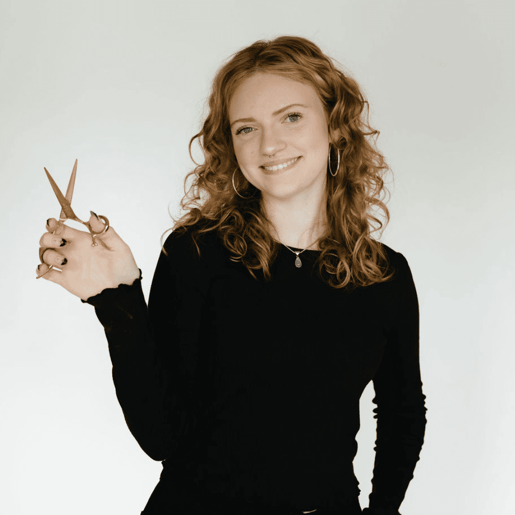Portrait of Emily Baldwin, a professional stylist at Ashlyn Jamyson Salon & Spa, showcasing their expertise and style.