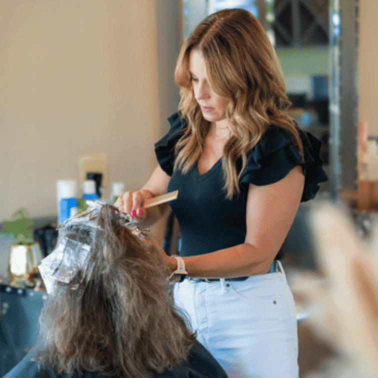 Portrait of Jessica Clark, a professional stylist at Ashlyn Jamyson Salon & Spa, showcasing their expertise and style.