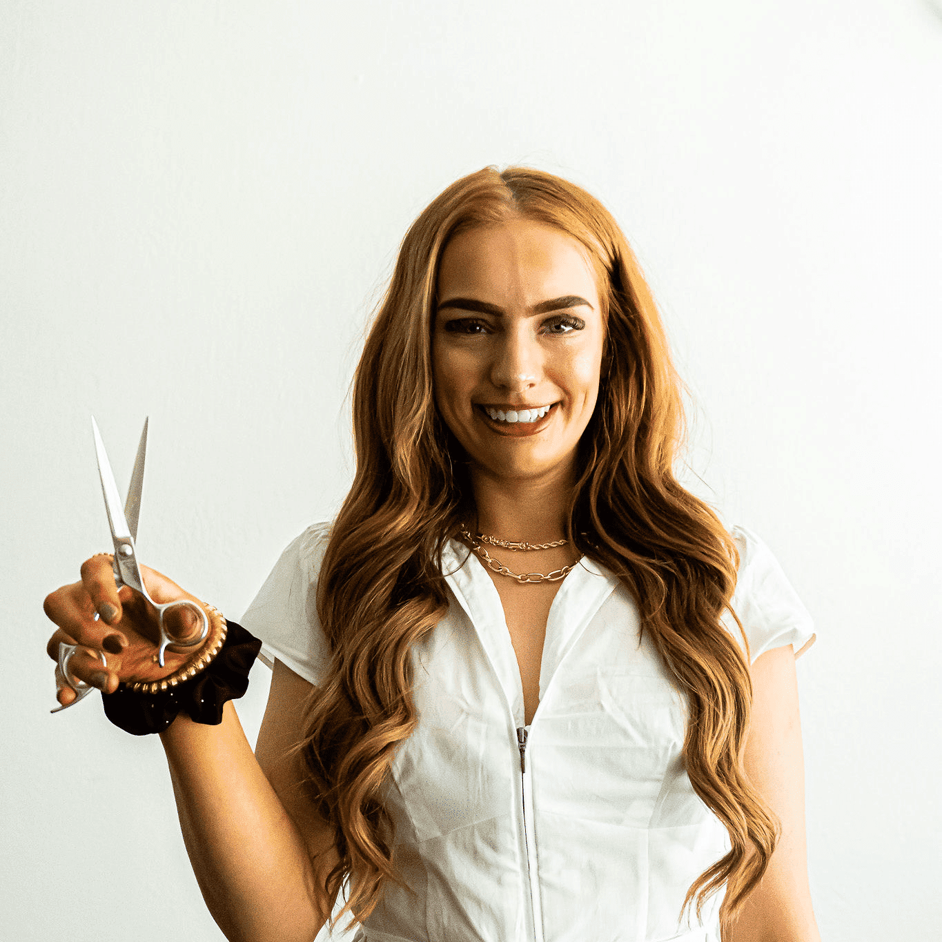 Portrait of Emma Peterson, a professional stylist at Ashlyn Jamyson Salon & Spa, showcasing their expertise and style.