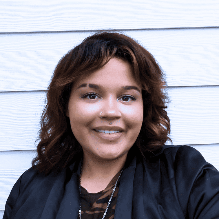 Portrait of Alana Leigh Woods, a professional stylist at Ashlyn Jamyson Salon & Spa, showcasing their expertise and style.